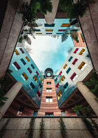 High angle view of buildings by swimming pool against sky