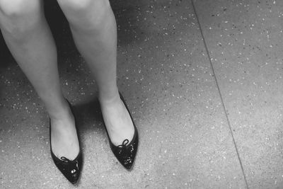 Low section of woman standing on floor