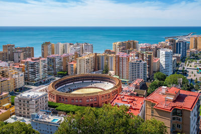 High angle view of buildings in city against sky