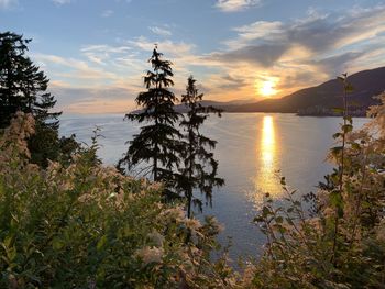 Scenic view of lake against sky during sunset