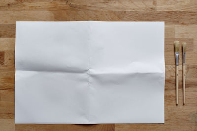 High angle view of paper on table