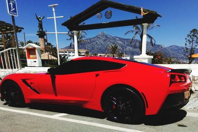 Red car against sky