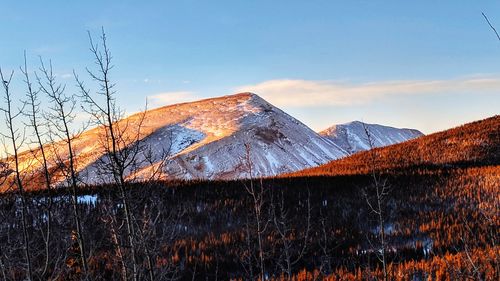 Scenic view of mountains against sky during winter