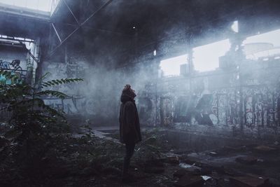 Man standing in abandoned building