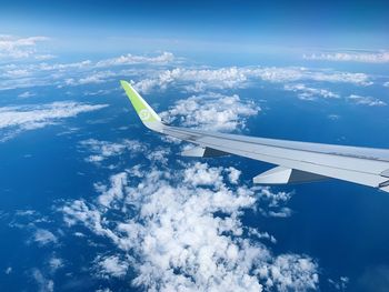 Aerial view of airplane flying in sky