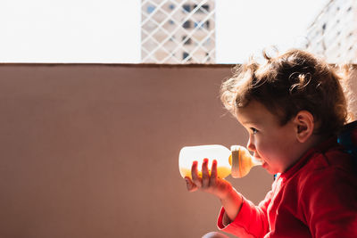 Portrait of boy holding ice cream