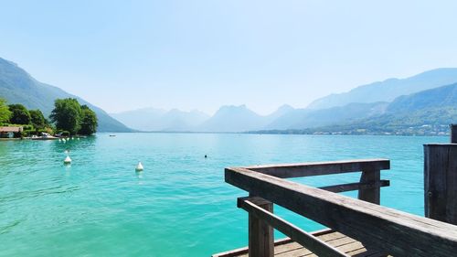 Scenic view of swimming pool by lake against sky