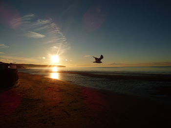 Scenic view of sea at sunset