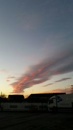 Built structure against sky at sunset