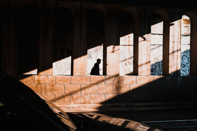 Silhouette of person on street