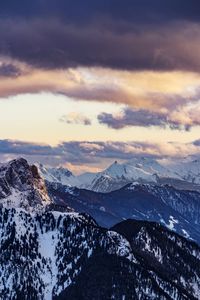 Scenic view of snowcapped mountains against sky during sunset