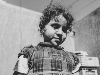 Low angle view of girl standing at home