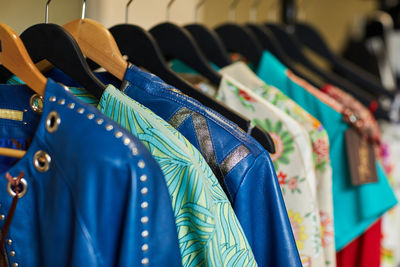 Close-up of clothes hanging on rack at store