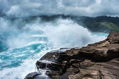 Waves breaking against the sky