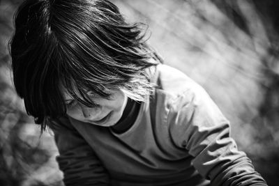 Close-up of boy looking down