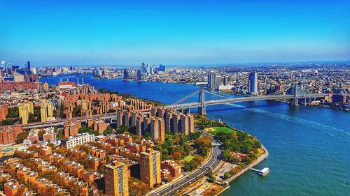 High angle view of bridge over river by buildings in city