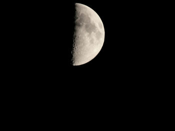 Low angle view of moon against sky at night