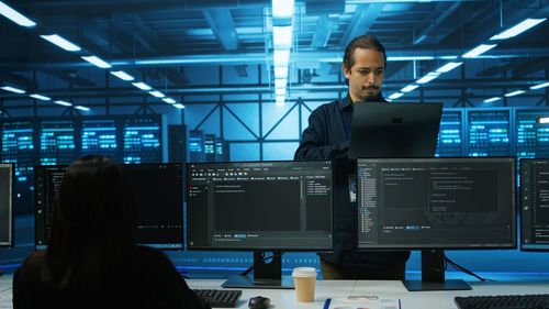 Rear view of man working in office