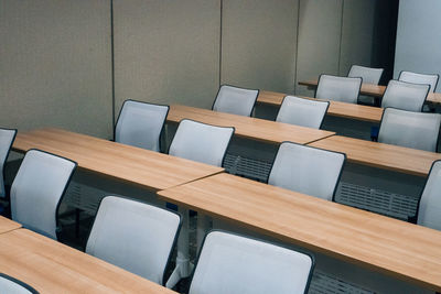 High angle view of chairs on table