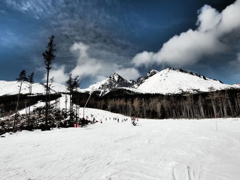 Scenic view of landscape against cloudy sky