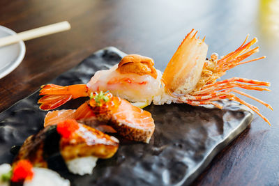 High angle view of fresh orange in plate on table