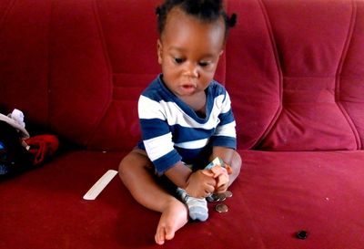 High angle view of cute baby boy sitting