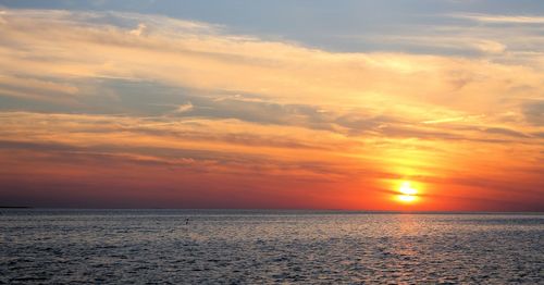 Scenic view of sea at sunset