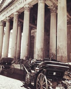 Low angle view of bicycles parked in front of building