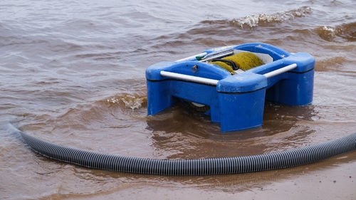 High angle view of blue container on land