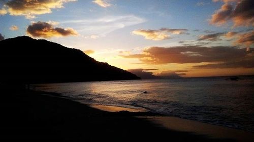 Scenic view of sea at sunset