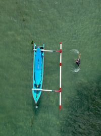 High angle view of man swimming in sea