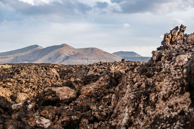 Rock formations in desert against sky