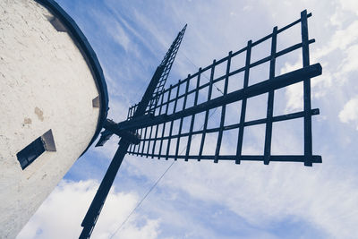 Low angle view of windmill against sky