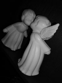 Close-up of statue against black background