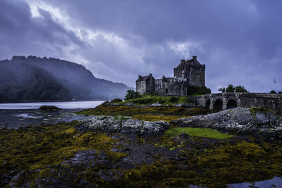 View of castle against cloudy sky