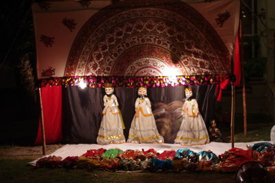 Buddha statues in illuminated temple