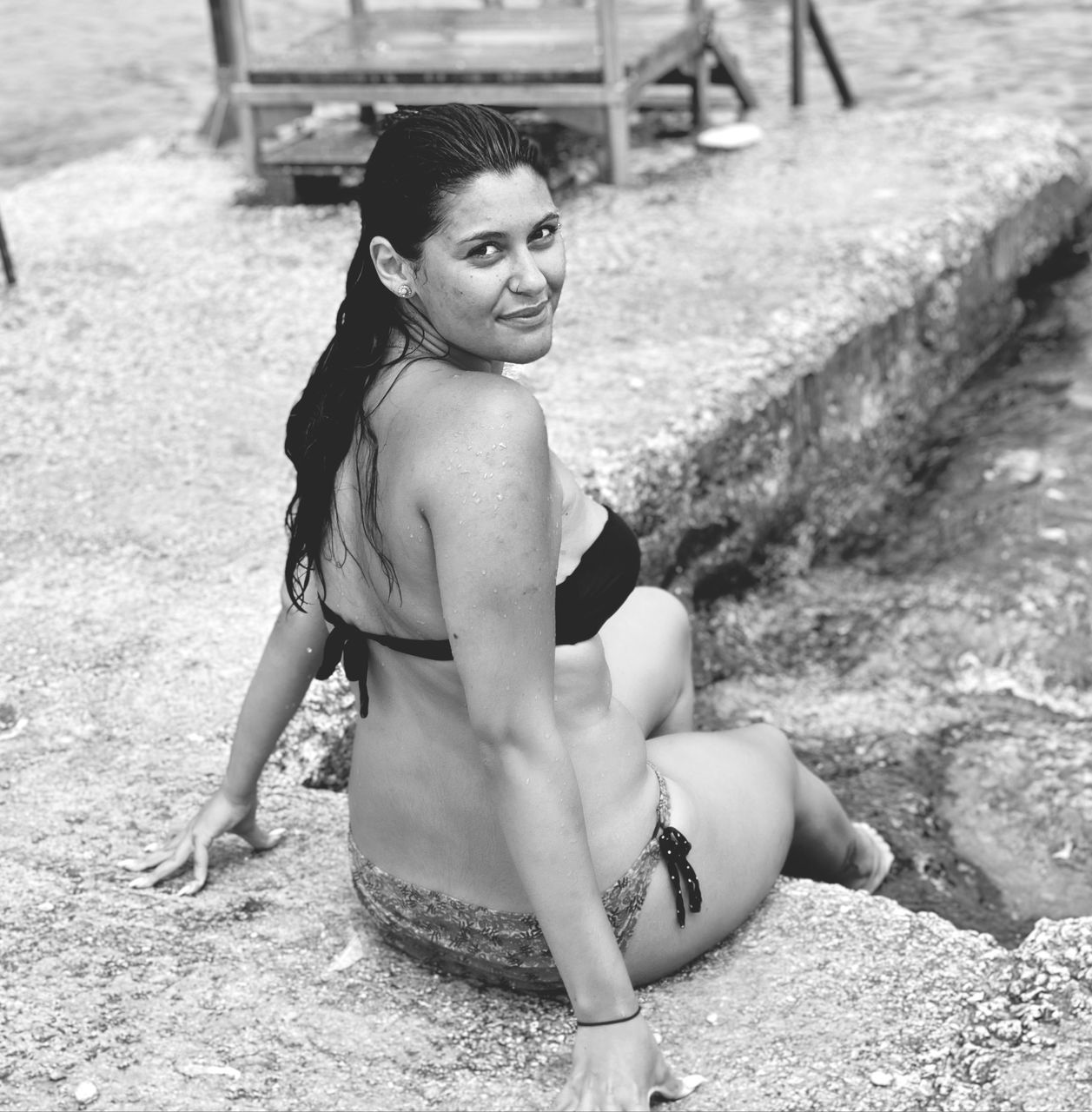 sitting, black and white, one person, women, female, photo shoot, full length, monochrome photography, adult, young adult, clothing, lifestyles, portrait, white, monochrome, person, human leg, leisure activity, looking at camera, nature, day, portrait photography, child, land, black, fashion, childhood, relaxation, hairstyle, human hair, swimwear, outdoors, human face, limb, summer, bikini, smiling