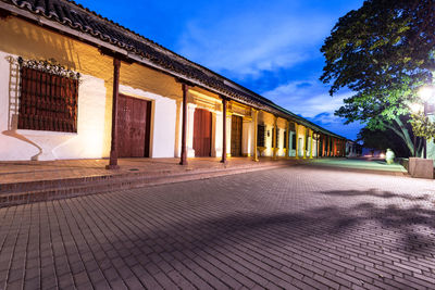 Street by houses at dusk