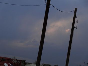 Low angle view of power lines against sky