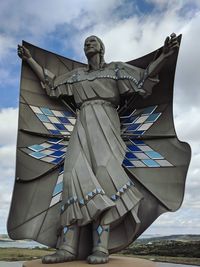 Low angle view of statue against sky