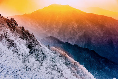 Scenic view of mountains against sky during sunset