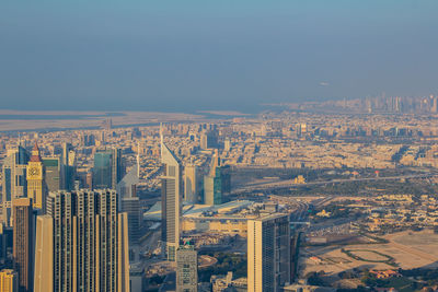 High angle view of buildings in city against clear sky