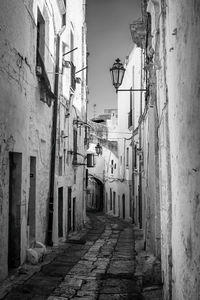 Narrow street amidst buildings in town