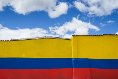 Low angle view of house against blue sky