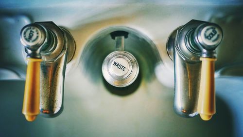 Directly above view of taps with text on sink