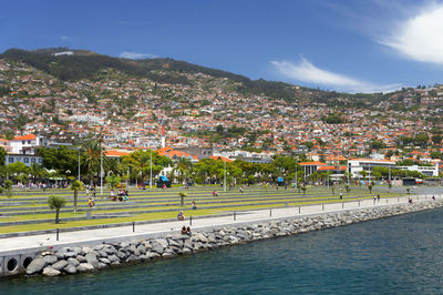 Low angle view of townscape against blue sky