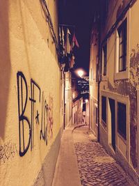 Walkway along buildings at night