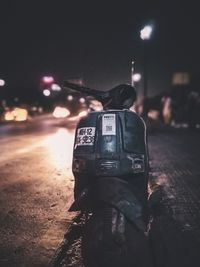 Close-up of illuminated car on street at night