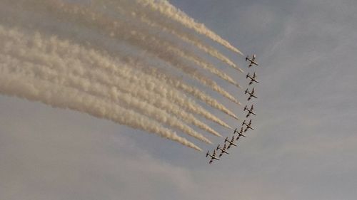 Low angle view of airplane flying in sky