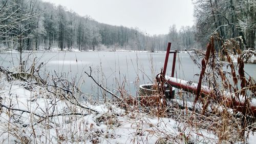 Scenic view of frozen lake against sky during winter